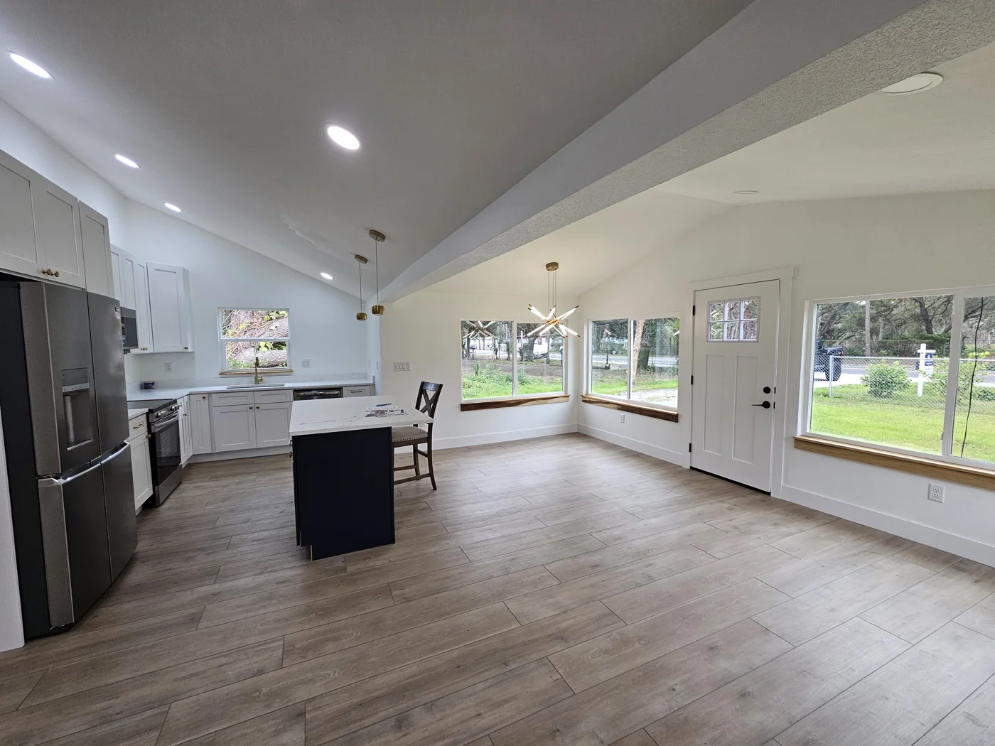 Renovated open kitchen and living area featured by Graham Group