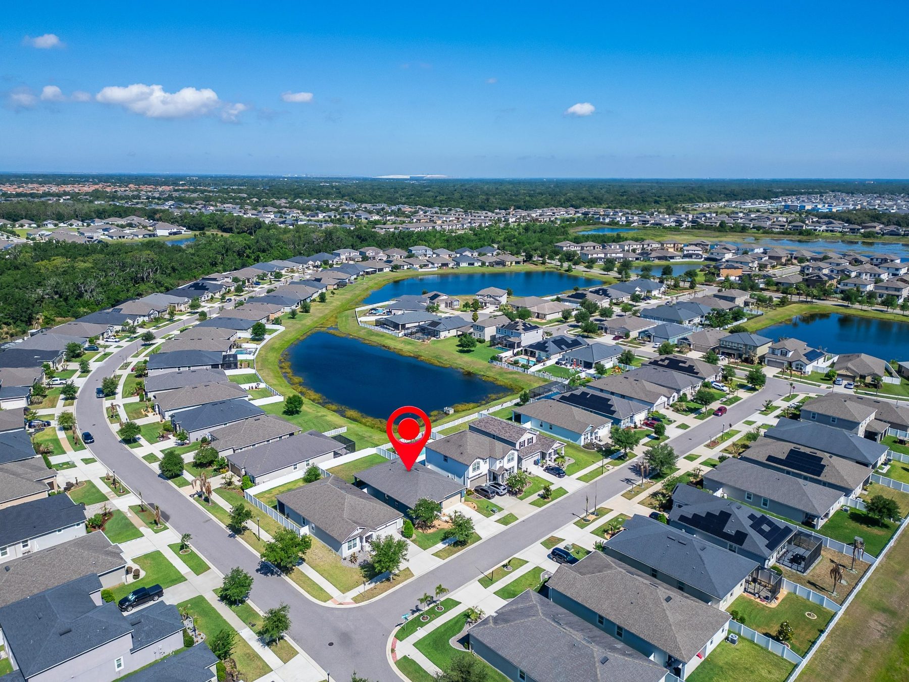 Aerial lake and neighborhood view near 13517 Texas Sage Place