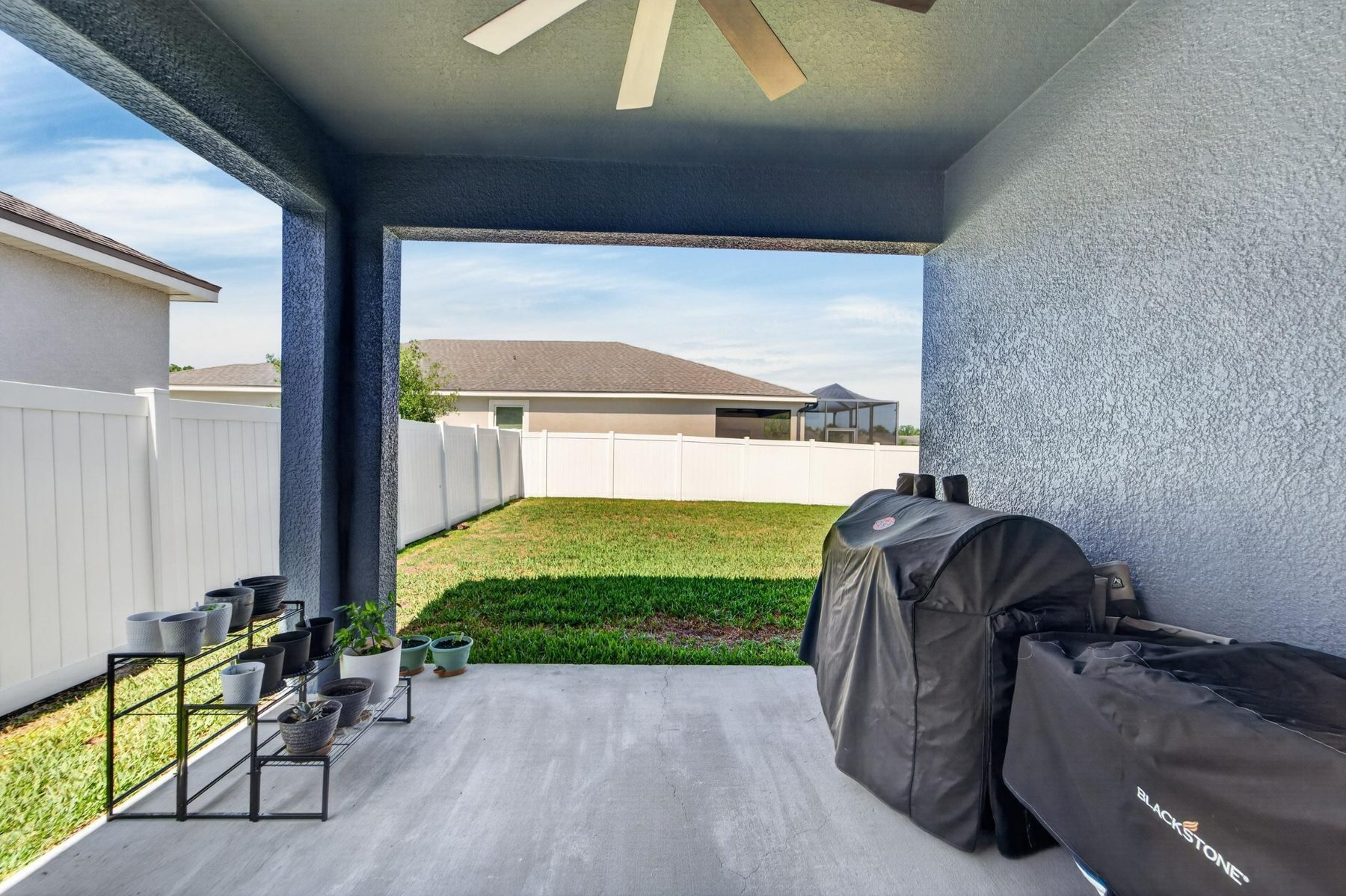 Covered lanai and fenced backyard at 13517 Texas Sage Place