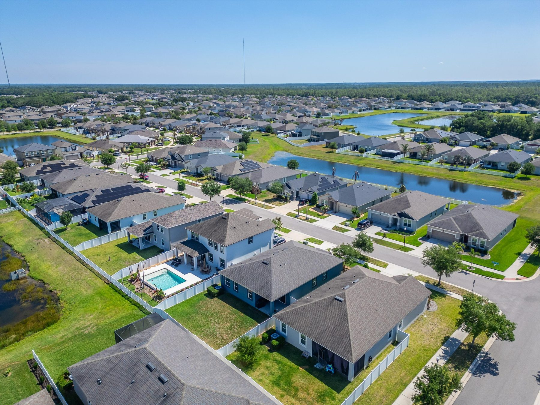 Aerial neighborhood and water view around 13517 Texas Sage Place